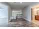 Upstairs hallway has luxury vinyl plank flooring and leads to a bath and a bedroom at 4113 Hoffmeister Dr, Waxhaw, NC 28173