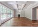 Bright living room with fireplace, coffered ceilings and hardwood flooring at 4113 Hoffmeister Dr, Waxhaw, NC 28173