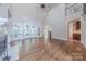 Inviting living room with hardwood floors, fireplace, vaulted ceilings, and access to a covered deck at 4113 Hoffmeister Dr, Waxhaw, NC 28173