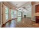 Living room featuring a fireplace, coffered ceiling and large windows providing an abundance of natural light at 4113 Hoffmeister Dr, Waxhaw, NC 28173