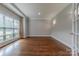 Bright office space with hardwood floors, neutral walls, and large window for natural light at 4113 Hoffmeister Dr, Waxhaw, NC 28173