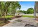 Backyard featuring a brick retaining wall and storage shed at 467 16Th Nw Ave, Hickory, NC 28601