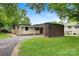 Single-story home featuring brick accents, a carport, and mature trees at 467 16Th Nw Ave, Hickory, NC 28601