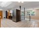 Bright open concept kitchen with stainless steel refrigerator, skylight, and tile flooring at 467 16Th Nw Ave, Hickory, NC 28601