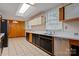 Galley kitchen features modern appliances, tile flooring, and a skylight that floods the space with natural light at 467 16Th Nw Ave, Hickory, NC 28601