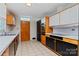Galley kitchen features modern appliances, tile flooring, and a skylight that floods the space with natural light at 467 16Th Nw Ave, Hickory, NC 28601