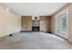 Large living room with a brick fireplace and ample natural light at 467 16Th Nw Ave, Hickory, NC 28601