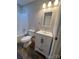 This bathroom has modern fixtures and bright white cabinetry at 507 Putter Pl, Chester, SC 29706