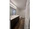 This bathroom has a double sink vanity, updated fixtures, and hard surface floors at 507 Putter Pl, Chester, SC 29706