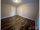 This bedroom features fresh neutral paint and wood-look flooring at 507 Putter Pl, Chester, SC 29706