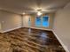 Living room with natural light, wood flooring, and neutral paint at 507 Putter Pl, Chester, SC 29706