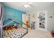 Inviting bedroom with blue accent wall, playful decor, and comfortable carpeting at 5359 Lake Glenn Dr, Stanfield, NC 28163