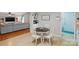 Open-concept dining area featuring a dining table, chairs and views of the living room and kitchen at 5359 Lake Glenn Dr, Stanfield, NC 28163