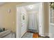 Cozy entryway featuring a wooden bench, decorative rug, and ample natural light at 5359 Lake Glenn Dr, Stanfield, NC 28163