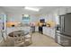 Modern kitchen with white cabinets, stainless steel appliances, and granite countertops at 5359 Lake Glenn Dr, Stanfield, NC 28163