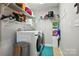 Practical laundry room features modern appliances, storage shelves, and ample space at 5359 Lake Glenn Dr, Stanfield, NC 28163