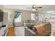 Bright living room featuring a comfortable sectional sofa, stylish decor, and natural light from the window at 5359 Lake Glenn Dr, Stanfield, NC 28163