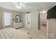This main bedroom includes a dresser, and mirror along with a walk in closet with sliding door at 5359 Lake Glenn Dr, Stanfield, NC 28163