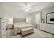 Bright main bedroom boasts neutral tones, large window, and a comfortable upholstered bed frame at 5359 Lake Glenn Dr, Stanfield, NC 28163