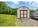 Backyard shed with a convenient ramp offers extra storage space, and is easily accessible at 5359 Lake Glenn Dr, Stanfield, NC 28163