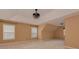 A large bedroom with a tray ceiling, fan fixture, and windows for lots of natural light at 5607 Fulton Ridge Dr, Indian Trail, NC 28079