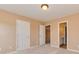 Bedroom featuring carpet, neutral walls, and multiple doorways at 5607 Fulton Ridge Dr, Indian Trail, NC 28079