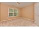 Bright bedroom features plush carpeting, window, and neutral walls at 5607 Fulton Ridge Dr, Indian Trail, NC 28079