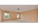Carpeted bedroom with two large windows offering a bright and airy feel at 5607 Fulton Ridge Dr, Indian Trail, NC 28079