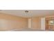 Carpeted bedroom with entry to a landing with a white bannister at 5607 Fulton Ridge Dr, Indian Trail, NC 28079