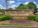 Community entrance sign 'Shiloh Trace' with beautiful flowers and manicured landscaping at 5607 Fulton Ridge Dr, Indian Trail, NC 28079
