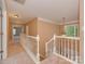Upstairs hallway featuring carpet, white trim, and lots of natural light at 5607 Fulton Ridge Dr, Indian Trail, NC 28079