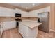 Updated kitchen with stainless steel appliances, a central island and ample storage at 5607 Fulton Ridge Dr, Indian Trail, NC 28079