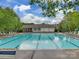 Large community swimming pool with lounge chairs and a covered area for relaxation at 5607 Fulton Ridge Dr, Indian Trail, NC 28079