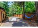 Backyard bocce ball court and blue hammock create outdoor relaxation at 6119 Bittersweet Ln, Charlotte, NC 28270