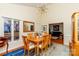 An airy dining room with a view of the living room and a modern light fixture at 6119 Bittersweet Ln, Charlotte, NC 28270
