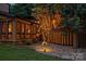 Well-lit home exterior featuring large windows and modern yard art at 6119 Bittersweet Ln, Charlotte, NC 28270