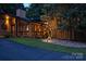 Exterior of this home showcases modern outdoor lighting and large windows at 6119 Bittersweet Ln, Charlotte, NC 28270