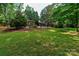 Front exterior showcases the home's landscaping and unique design at 6119 Bittersweet Ln, Charlotte, NC 28270