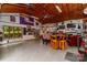 Spacious garage with high ceilings, ceiling fan, and custom organization at 6119 Bittersweet Ln, Charlotte, NC 28270