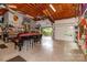 Spacious garage with overhead ceiling and door, ceiling fan, and custom organization at 6119 Bittersweet Ln, Charlotte, NC 28270