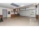 Bright garage with epoxy floors, white door, and custom wall décor at 6119 Bittersweet Ln, Charlotte, NC 28270