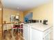 Eat-in kitchen featuring modern countertops, white cabinetry, and an adjacent dining area, providing a functional layout at 6119 Bittersweet Ln, Charlotte, NC 28270