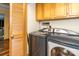 A laundry room with a newer washer and dryer, as well as plenty of storage at 6119 Bittersweet Ln, Charlotte, NC 28270
