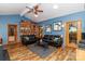 Spacious living room with stylish decor, a built-in bookshelf, and hardwood floors, creating an inviting atmosphere at 6119 Bittersweet Ln, Charlotte, NC 28270