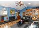 Inviting living room with a fireplace, built-in shelving, and hardwood floors, perfect for cozy evenings and gatherings at 6119 Bittersweet Ln, Charlotte, NC 28270