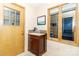 A charming powder room with a single sink, granite countertop, and wood accents at 6119 Bittersweet Ln, Charlotte, NC 28270