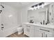 Modern bathroom with double vanity, white cabinets, and a combined tub and shower at 622 Bayou Cir, Clover, SC 29710