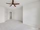 Spacious bedroom with neutral carpet and white walls leading to an open doorway at 622 Bayou Cir, Clover, SC 29710