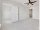 Bright bedroom with neutral carpet and white walls leading to closet and hallway at 622 Bayou Cir, Clover, SC 29710