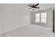 Bright bedroom with neutral carpet, white walls, ceiling fan, and a double window at 622 Bayou Cir, Clover, SC 29710
